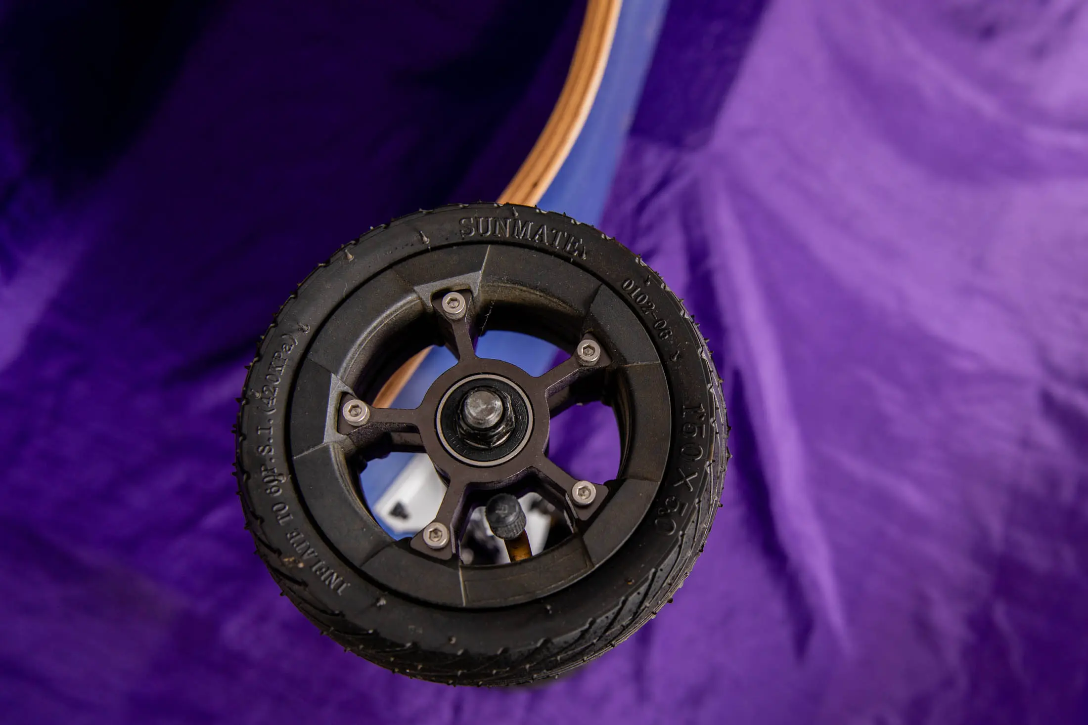 Black wheel on a purple background.
