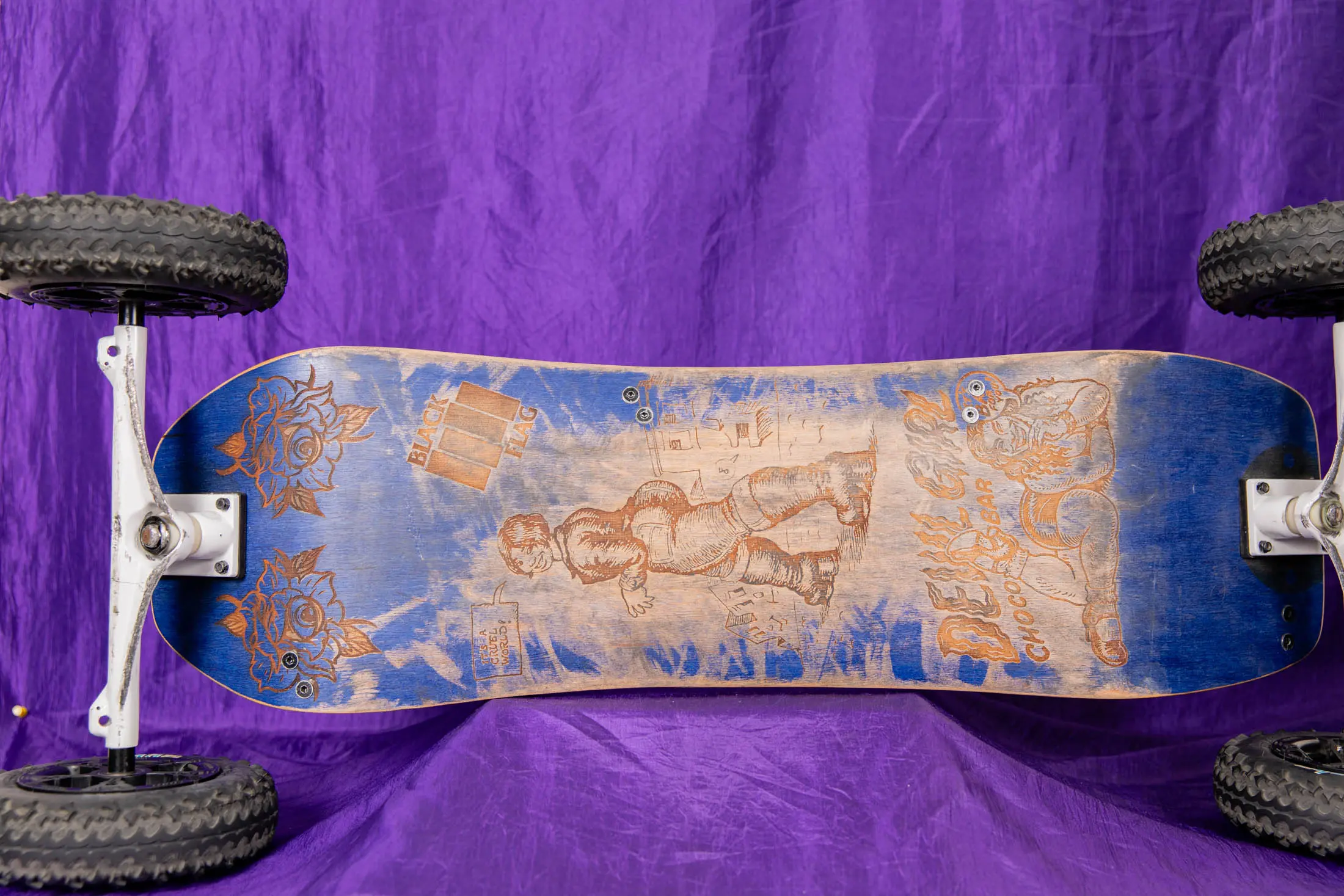 Mountain board with purple background, intricate design.